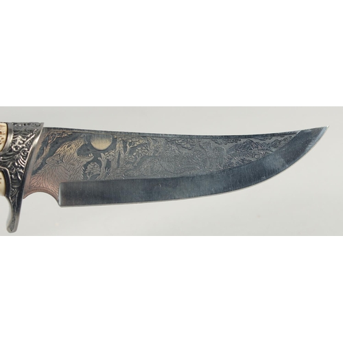 17 - A KNIFE WITH A STAINLESS STEEL BLADE, engraved with a fox and cubs with antler handle carved and pie... 