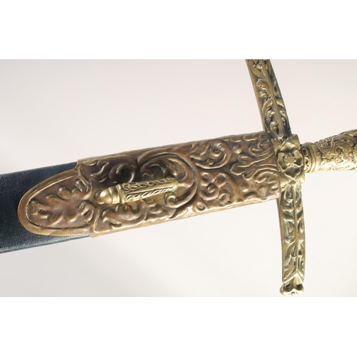 174 - A THEATRICAL REPLICA OF A KNIGHTLY SWORD, early 20th century, straight pointed 33.5 in blade, cast b... 