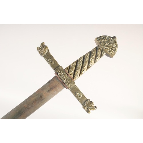 189 - A REPLICA OF A KNIGHTLY SWORD, early 20th century, straight edged pointed 36in blade, brass crucifor... 