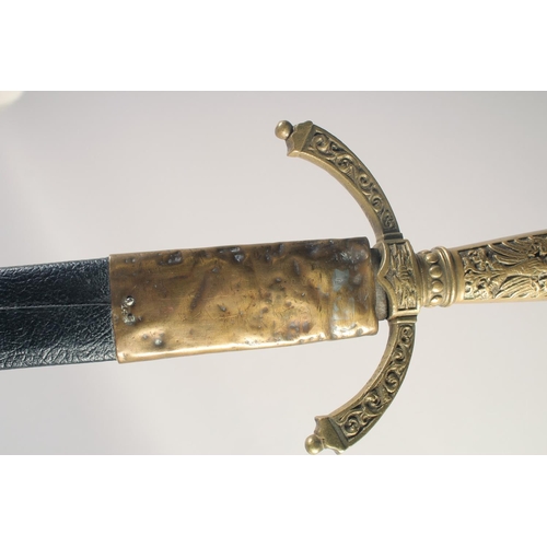 201 - A THEATRICAL REPLICA OF A KNIGHTLY SWORD, early 20th century, straight pointed 34in blade, cast bras... 