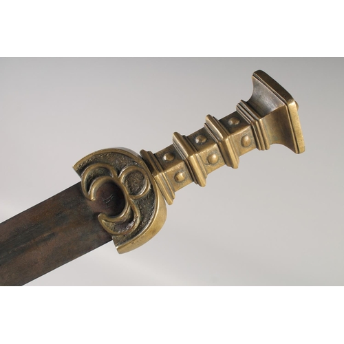 211 - A REPLICA OF AN IRON AGE SWORD, early 20th century, wide straight pointed 27in blade with an armoure... 