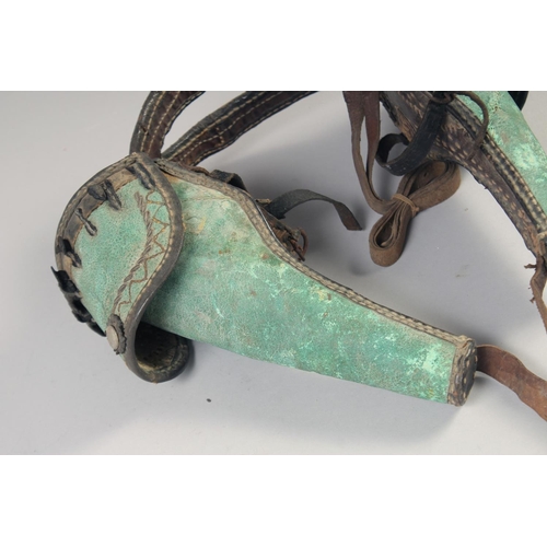 218 - A PAIR OF AMERICAN INDIAN/CIVIL WAR PERSONAL POMMEL HOLSTERS, late 19th century, green leather, with... 