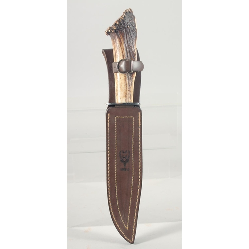 22 - A MUELA SARRIO SPANISH KNIFE, with an antler handle, 13