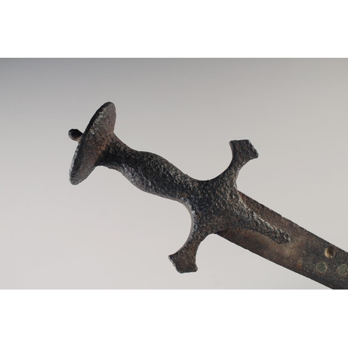 222 - AN INDIAN TULWAR, mid-18th century, 28in fullered blade and typical hilt, overall rusted.