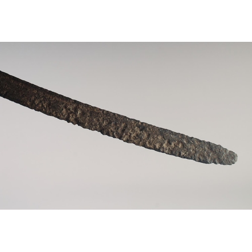 222 - AN INDIAN TULWAR, mid-18th century, 28in fullered blade and typical hilt, overall rusted.