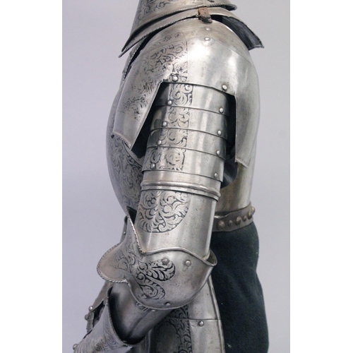 229 - A GOOD 19th CENTURY FULL ARMOUR, deeply etched all over with foliate scrolls and mythical beasts on ... 