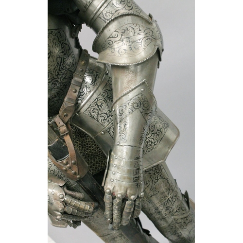 229 - A GOOD 19th CENTURY FULL ARMOUR, deeply etched all over with foliate scrolls and mythical beasts on ... 