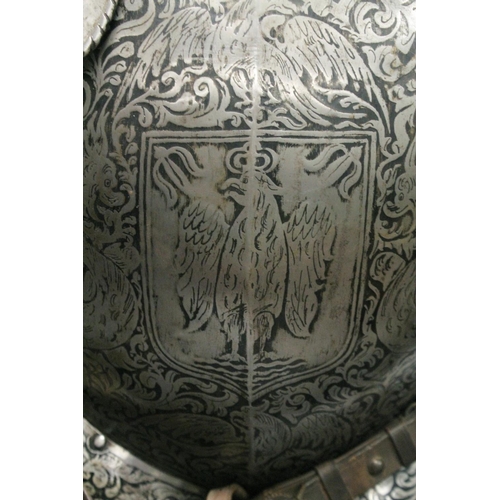 229 - A GOOD 19th CENTURY FULL ARMOUR, deeply etched all over with foliate scrolls and mythical beasts on ... 