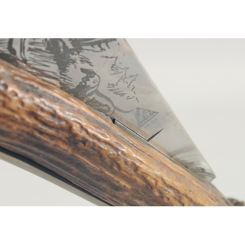 27 - INDIANA INOX, A LARGE HUNTING KNIFE, the blade engraved with two deer and a dog, blade 12