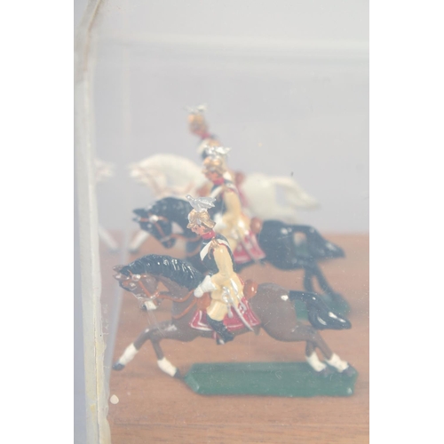 278 - A DIECAST SET, of twelve mounted cavalry, in a Perspex case.