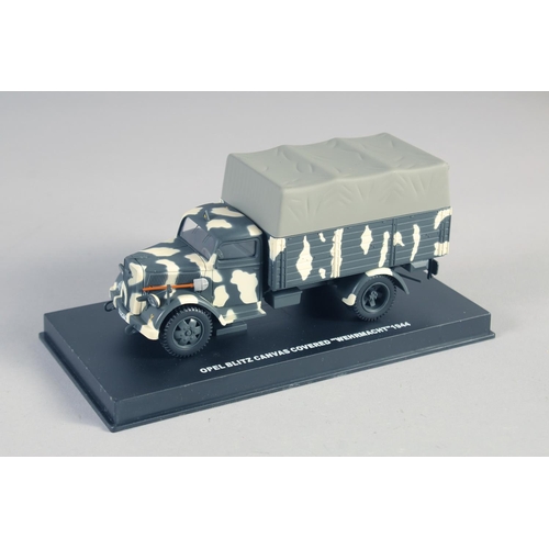 284 - FOUR VARIOUS ARMORED VEHICLES, boxed.