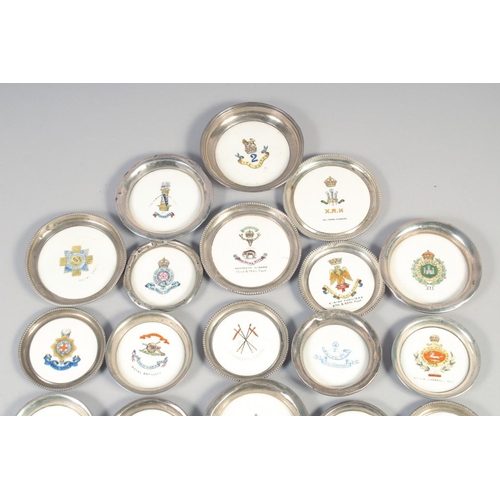 363 - A COLLECTION OF TWENTY ONE AYNSLEY PORCELAIN AND SILVER STANDS, with military coat of arms in a leat... 