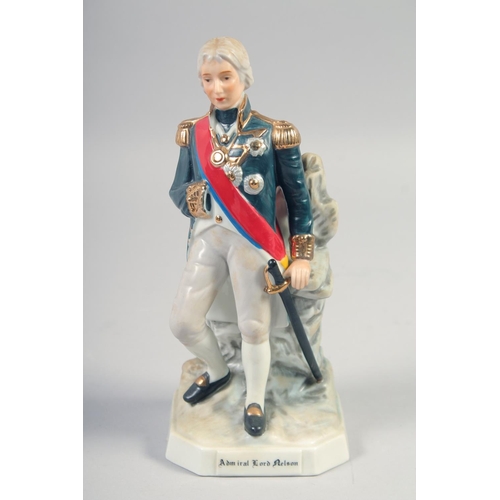 384 - A PORCELAIN FIGURE OF ADMIRAL LORD NELSON AN NAPOLEON, 8.5