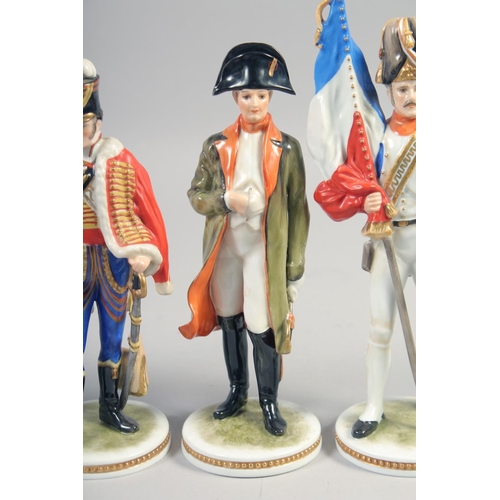 386 - KAISER, A SET OF FOUR PORCELAIN FIGURES, Napoleon, Lancer, Key, Tunoy, hand painted, colour bearer, ... 