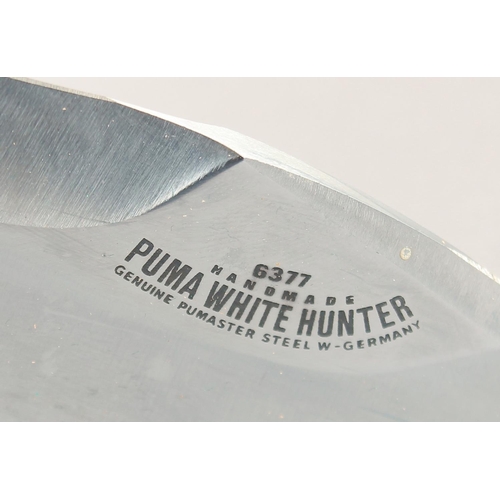 45 - A PUMA WHITE HUNTER KNIFE 6377, with antler handle in a leather sheath, 10