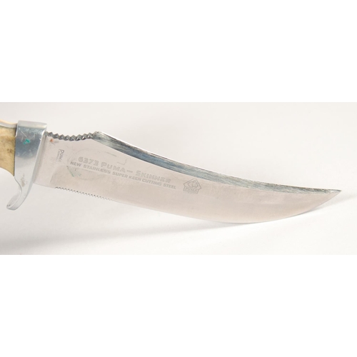 47 - THE 637 PUMA-SKINNER KNIFE WITH SUPER KEEN CUTTING STEEL, with antler handle, in a leather sheath, 9... 