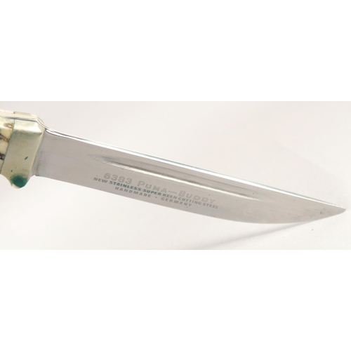 48 - THE 6383 PUMA BUDDY KNIFE, with super keen cutting steel, antler handle in a leather sheath.