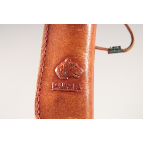 48 - THE 6383 PUMA BUDDY KNIFE, with super keen cutting steel, antler handle in a leather sheath.