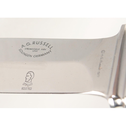 51 - A.G. RUSSELL SOLINGEN, a knife with two-tone handle. 7.5