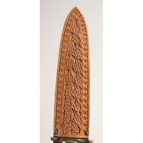 53 - A KNIFE, with brass mounts and antler handle, in a sheath with oak leaves, 10