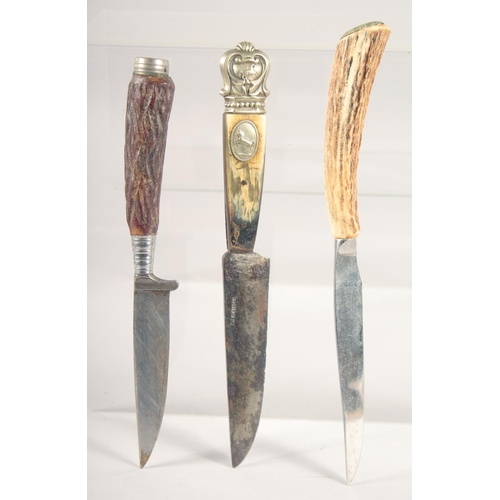 71 - THREE VARIOUS KNIVES, with antler handles, 8