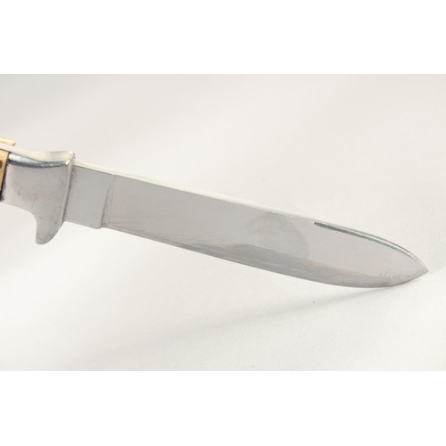 72 - A KNIFE, with antler handle in a sheath, 9