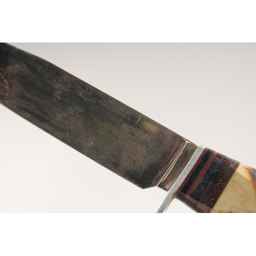 73 - A KNIFE, with antler handle, in a sheath with a deer. 8.5