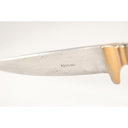 83 - A ROSTFREI KNIFE, with antler handle, in a sheath, 7.5