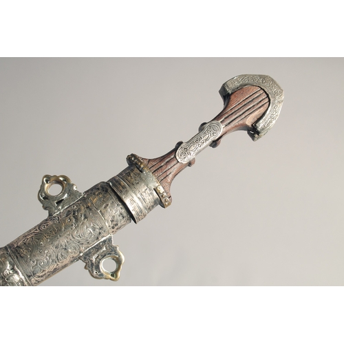 231 - A 19TH CENTURY MOROCCAN KAMAYA SILVER MOUNTED DAGGER, and scabbard, 41cm long.