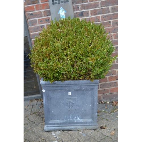 1 - A pair of large faux lead square shaped planters complete with box shrugs.