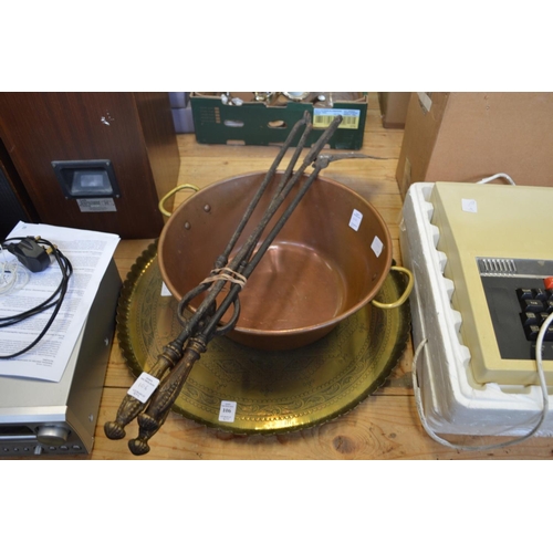 106 - A brass tray, copper preserve pan and a set of three fireside tools.