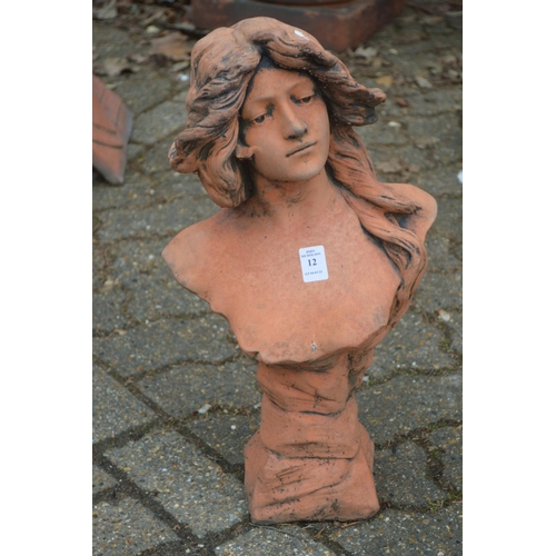 12 - A terracotta coloured classical bust of a young woman.