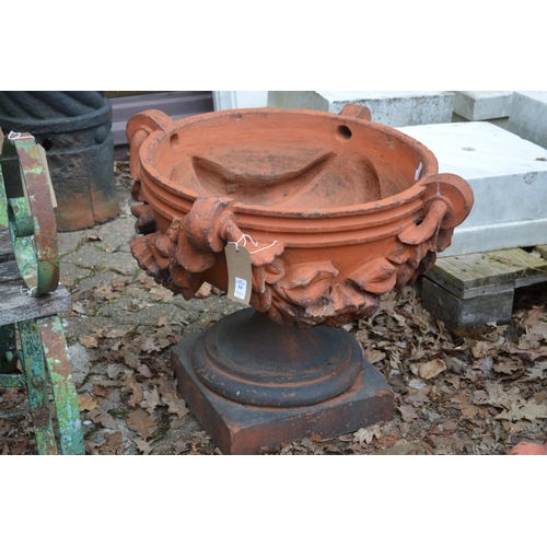 14 - A good set of three large terracotta classical shaped pedestal garden urns/planters.