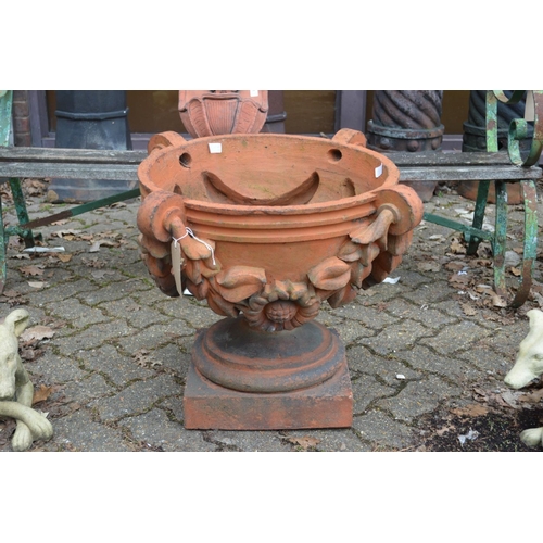 14 - A good set of three large terracotta classical shaped pedestal garden urns/planters.