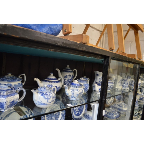 172 - A large quantity of blue and white teapots and jugs.