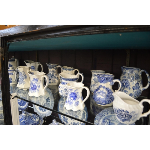 172 - A large quantity of blue and white teapots and jugs.