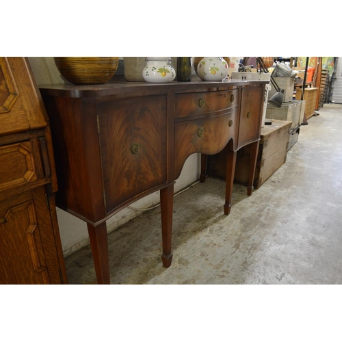 192 - A mahogany serpentine fronted sideboard.