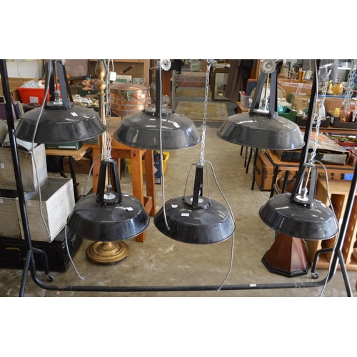 220 - A set of six large black painted steel hanging lanterns.