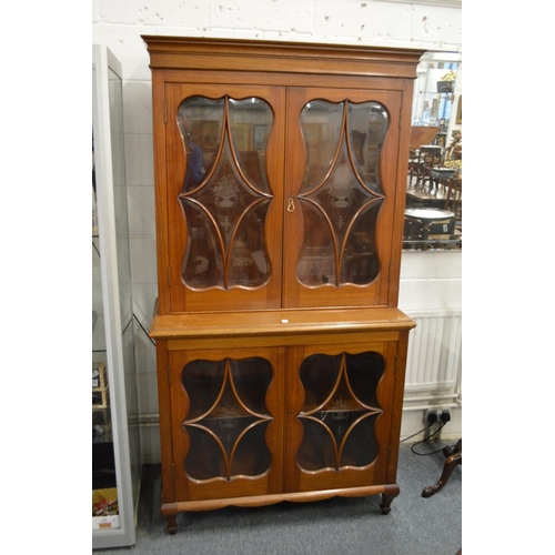 224 - A mahogany cupboard bookcase.