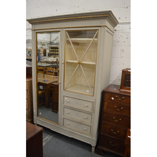 231 - A good grey painted French armoire with a single mirrored door, glazed door and three small drawers.