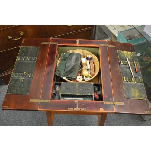 234 - An Edwardian mahogany work table with bi-fold top.