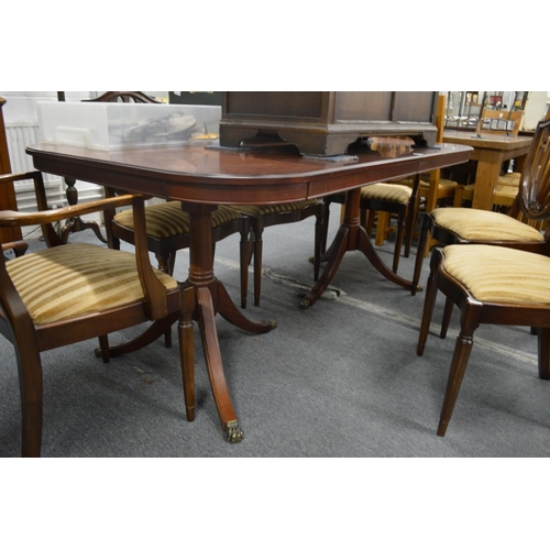 241 - A mahogany twin pillar extending dining table.