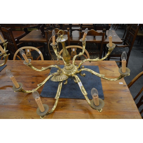 253 - A set of three good quality heavy brass eight branch chandeliers.