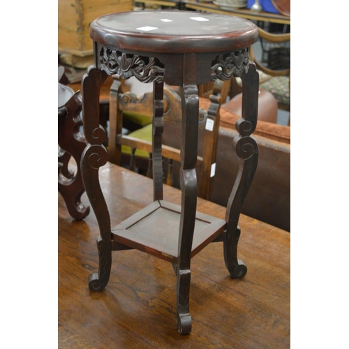 257 - A Chinese two tier urn stand.