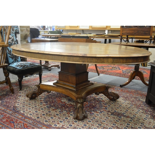 274 - A good early 19th century rosewood oval centre or dining table on a square column support, the conca... 