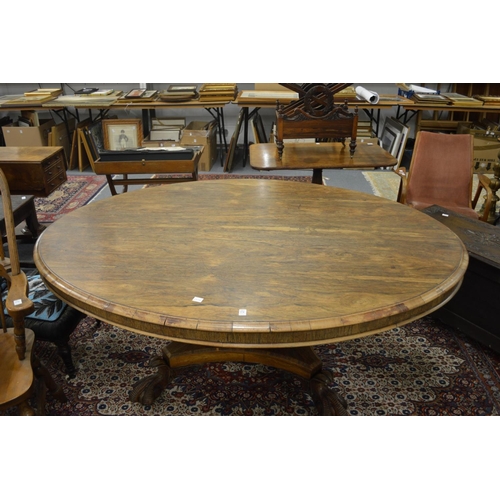 274 - A good early 19th century rosewood oval centre or dining table on a square column support, the conca... 