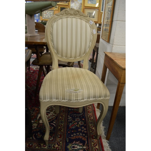 280 - A pair of painted and upholstered single chairs.