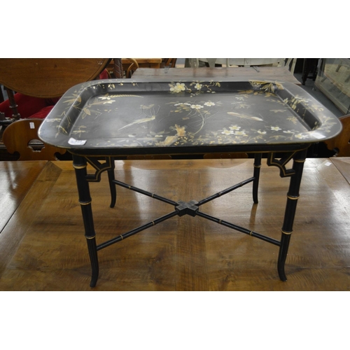 284 - A good chinoiserie style gilded and painted tray table with faux bamboo base.