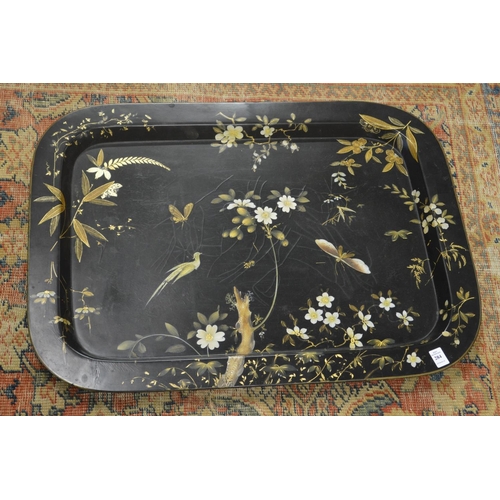 284 - A good chinoiserie style gilded and painted tray table with faux bamboo base.