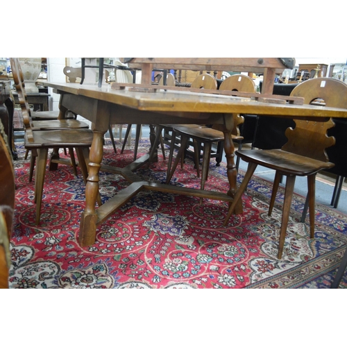 286 - An unusual Swiss walnut refectory style drawer leaf dining table together with a set of ten dining c... 